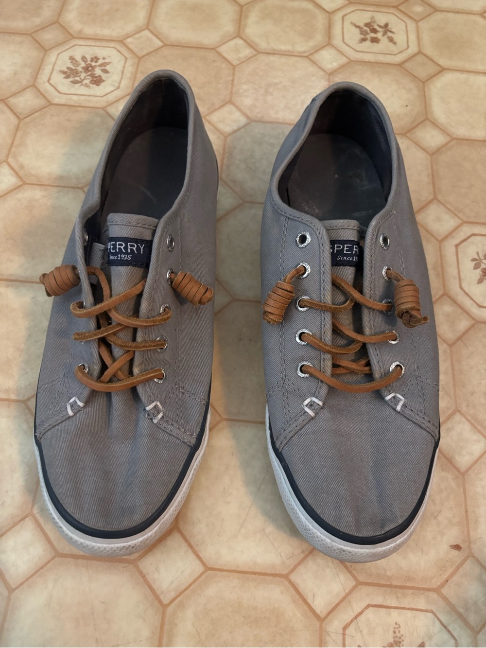 Sperry Women’s Gray Canvas Boat Shoes with Brown Laces.